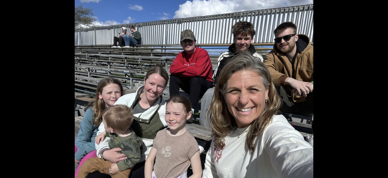 Family and crew selfie in the grandstands watching the race