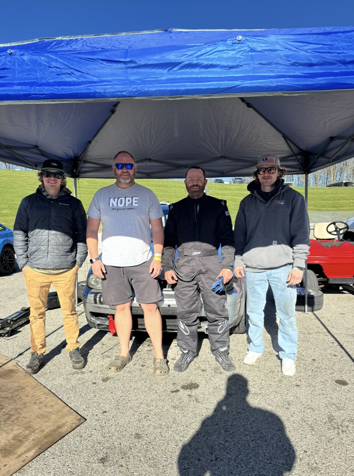 Pit crew team photo under the canopy at Road America