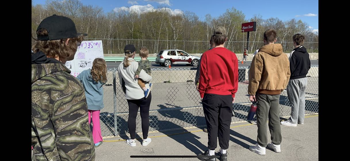 Fans watching the GTI pass by on track at Road America