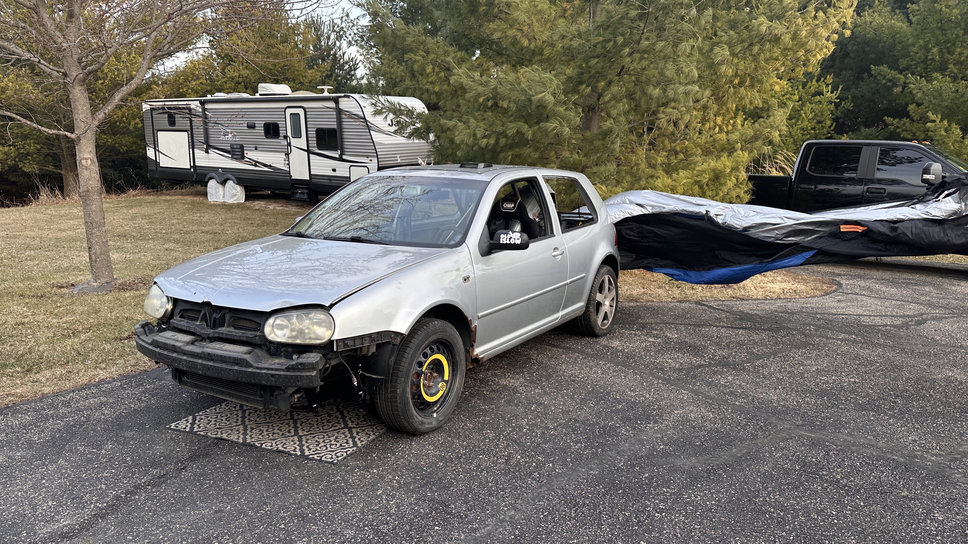 2001 Volkswagen Golf GTI 1.8T race car - silver with OMP racing seat and front bumper removed for cooling